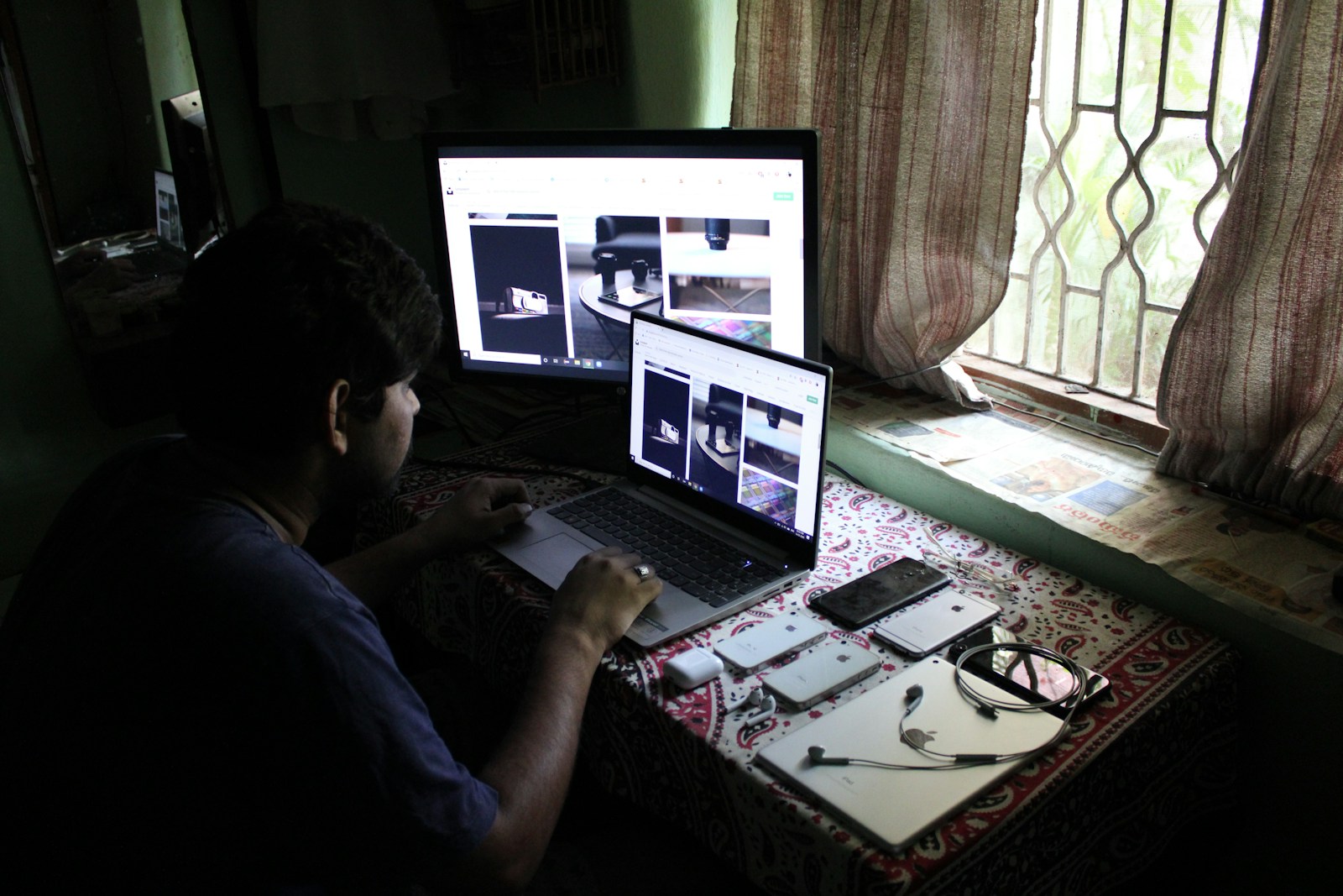 man in black shirt using laptop computer