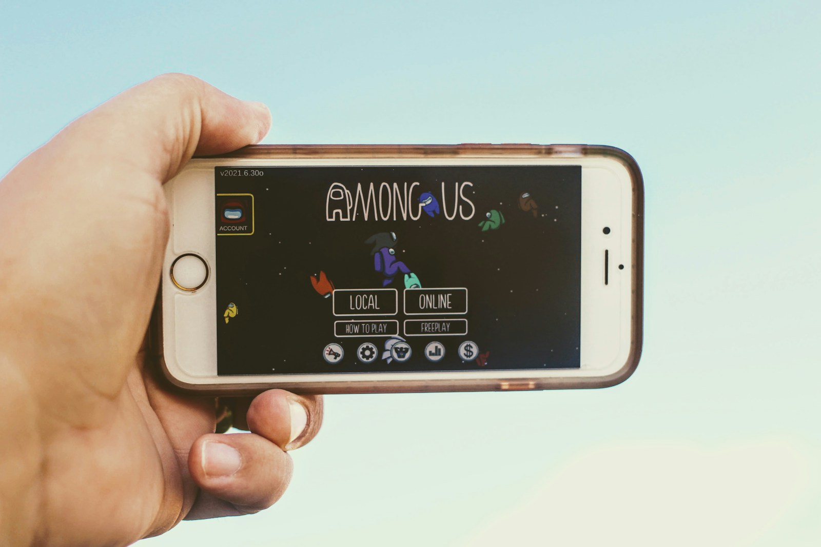 a person holding a smart phone in their hand